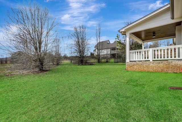 view of yard featuring ceiling fan