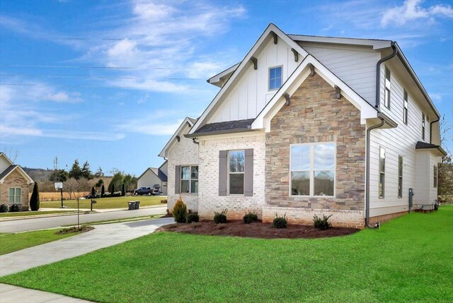 view of property exterior featuring a lawn