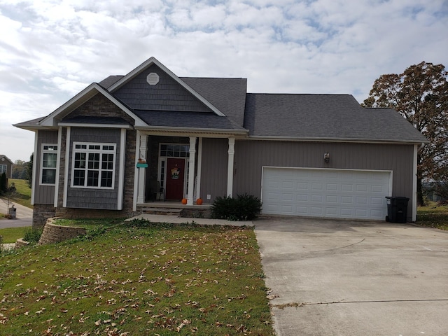 view of front of house with a front yard and a garage