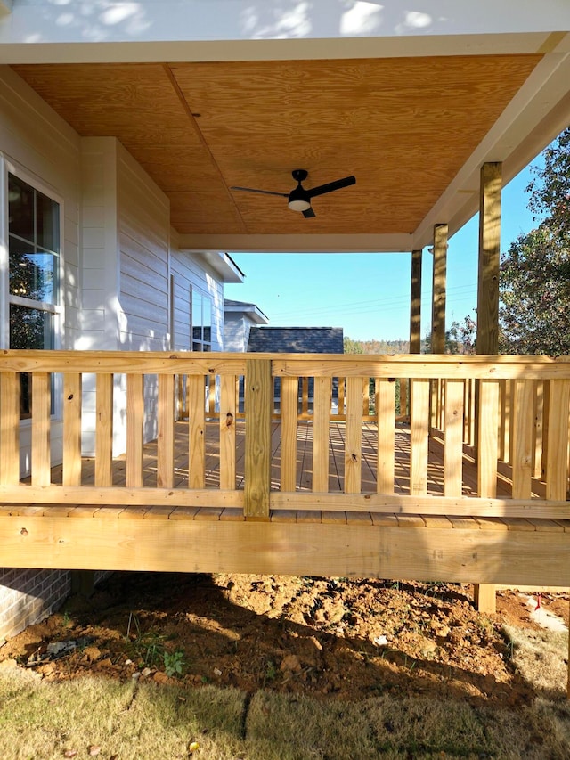 wooden terrace featuring ceiling fan