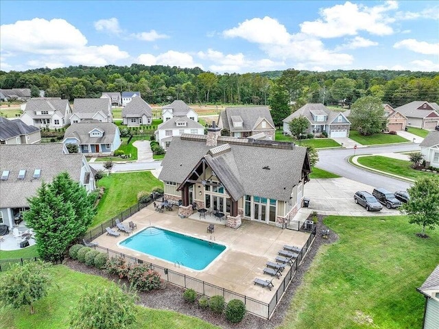 exterior space with a fenced backyard, a residential view, and a patio