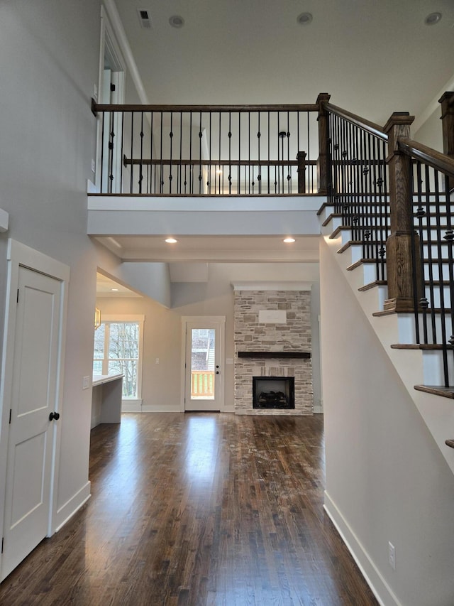 unfurnished living room with dark hardwood / wood-style floors and a fireplace