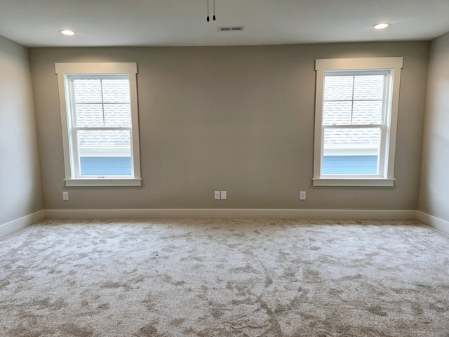 empty room with light colored carpet