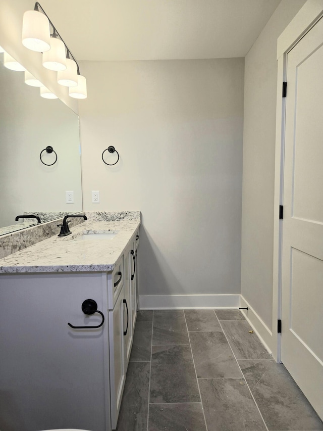 bathroom featuring tile patterned flooring and vanity