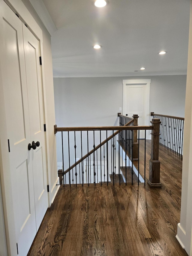 corridor featuring dark hardwood / wood-style flooring