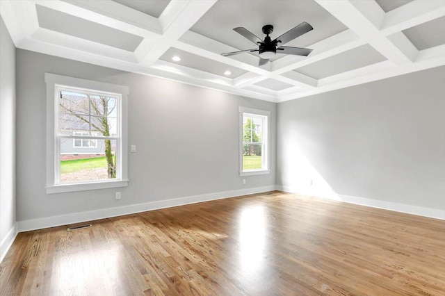 unfurnished room with baseboards, coffered ceiling, a ceiling fan, wood finished floors, and beam ceiling