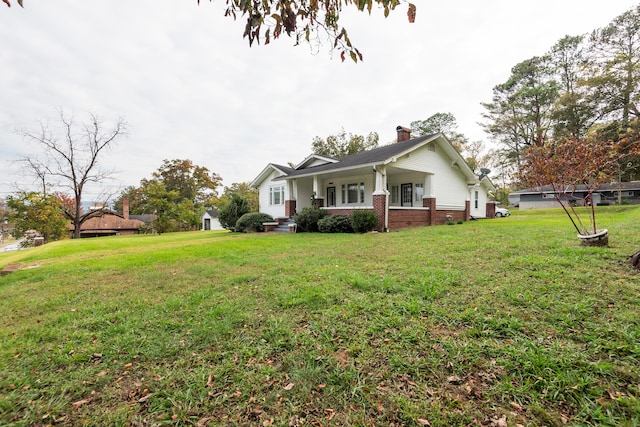 exterior space with a yard and a porch