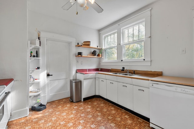 kitchen featuring sink, ceiling fan, dishwasher, and white cabinets