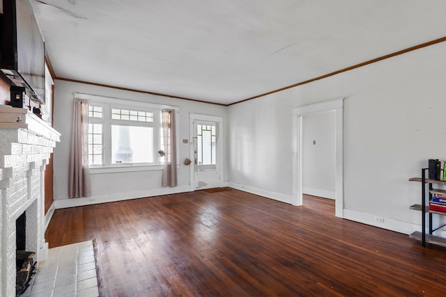 unfurnished living room featuring ornamental molding, a fireplace, and wood-type flooring