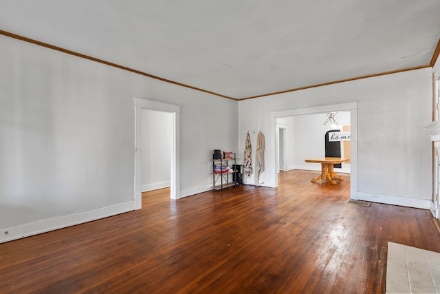 unfurnished living room with crown molding and hardwood / wood-style flooring