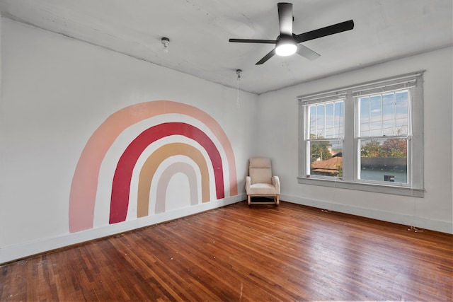 unfurnished room with wood-type flooring and ceiling fan