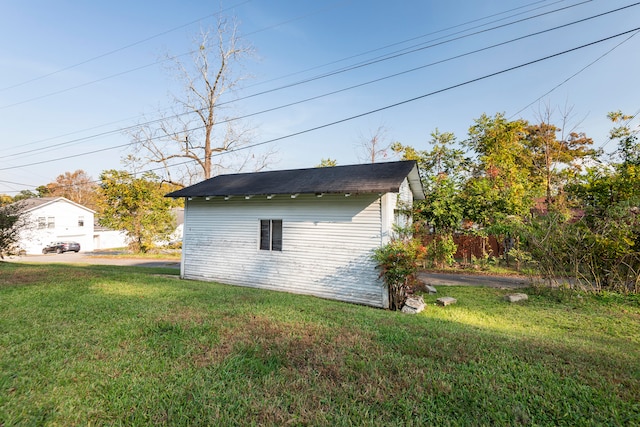 view of home's exterior with a yard