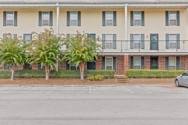 view of front of property with a balcony