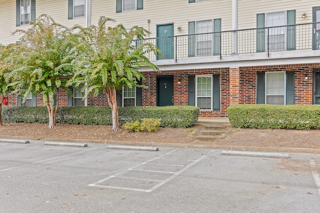 entrance to property with a balcony