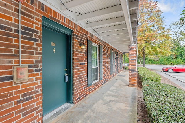 doorway to property featuring covered porch