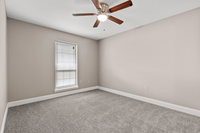 empty room featuring carpet flooring and ceiling fan