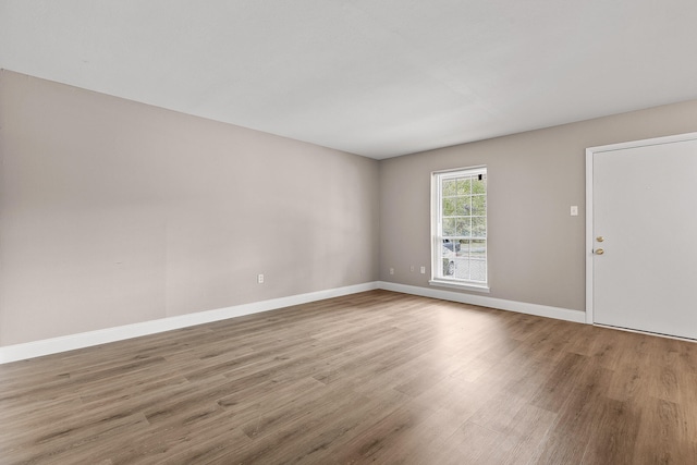 empty room featuring hardwood / wood-style flooring