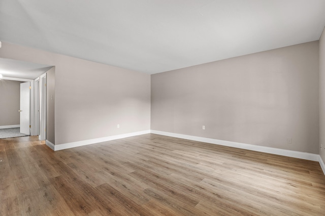 spare room featuring light wood-type flooring