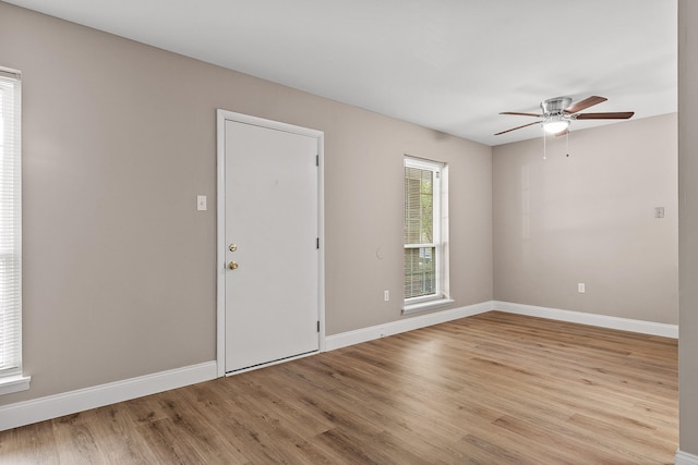 unfurnished room featuring ceiling fan and light wood-type flooring