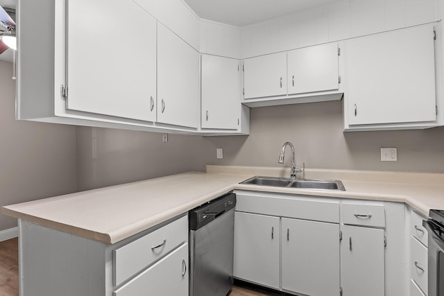 kitchen with white cabinets, stainless steel dishwasher, sink, and dark hardwood / wood-style flooring