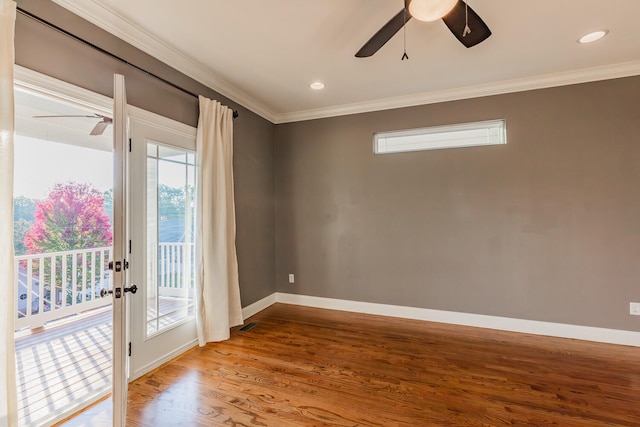 spare room featuring ornamental molding, hardwood / wood-style floors, and ceiling fan