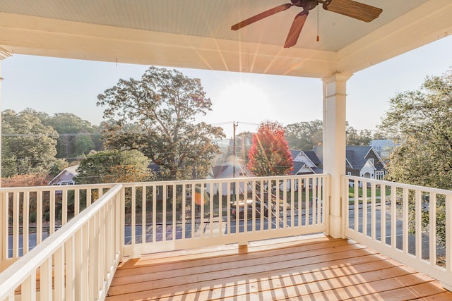 wooden terrace featuring ceiling fan