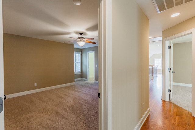 corridor featuring light hardwood / wood-style flooring