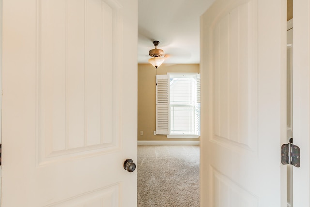 hallway with carpet flooring