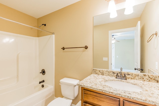 full bathroom with vanity, shower / washtub combination, toilet, and ceiling fan