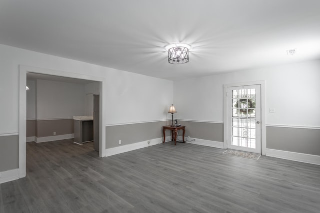 empty room featuring dark wood-type flooring