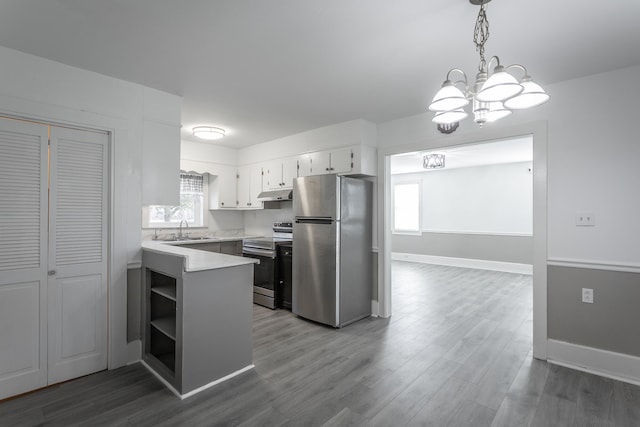 kitchen featuring white cabinetry, stainless steel appliances, a wealth of natural light, and dark wood-type flooring