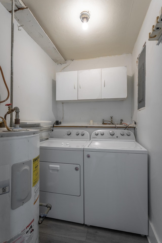 laundry room featuring cabinets, water heater, washer and dryer, electric panel, and dark hardwood / wood-style floors