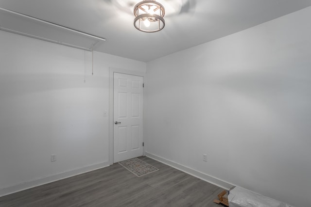 spare room with dark hardwood / wood-style flooring