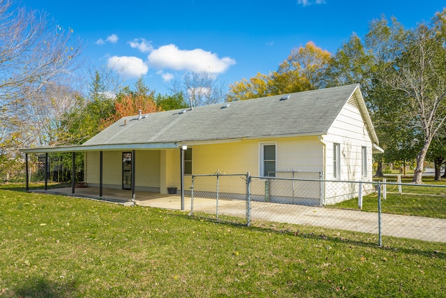 back of house featuring a yard and a patio