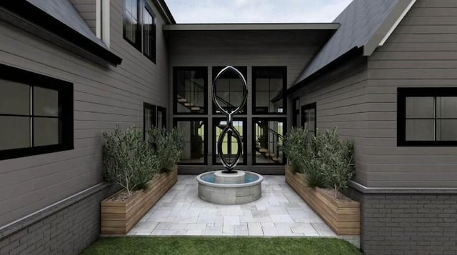 entrance to property featuring a patio