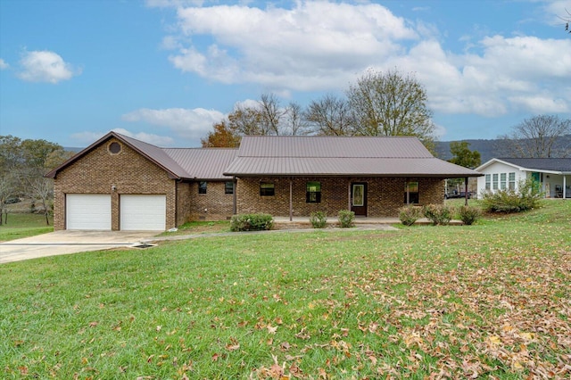 ranch-style home with a garage, a front lawn, and covered porch