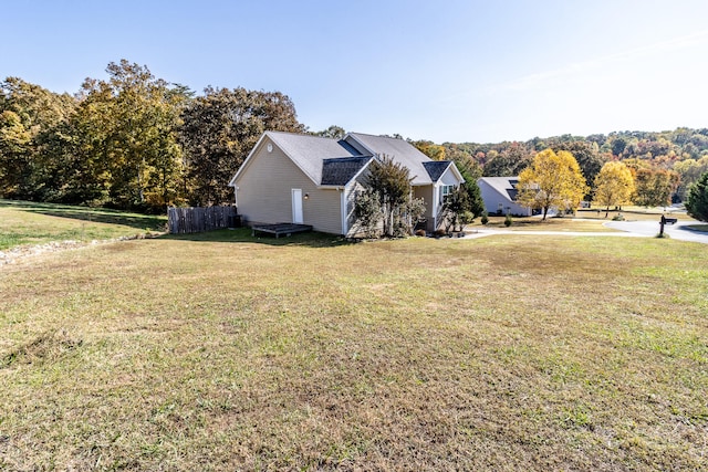 view of property exterior featuring a lawn