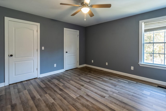 unfurnished bedroom with ceiling fan and hardwood / wood-style floors