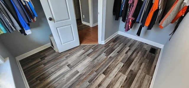 walk in closet featuring dark hardwood / wood-style flooring