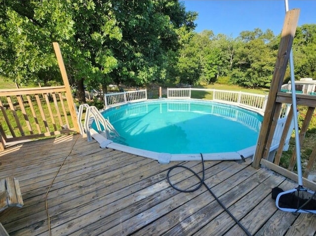 view of pool with a deck