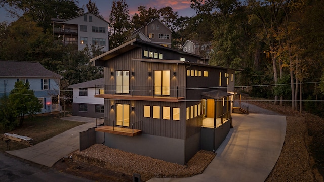 view of front of house featuring a balcony