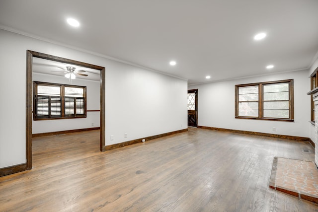 unfurnished room featuring hardwood / wood-style floors, ceiling fan, and ornamental molding