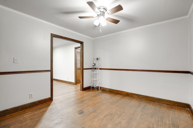 unfurnished room with ornamental molding, hardwood / wood-style flooring, and ceiling fan