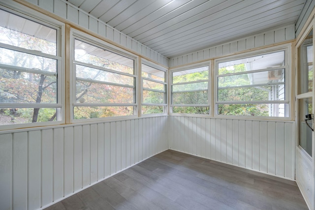 unfurnished sunroom with wood ceiling