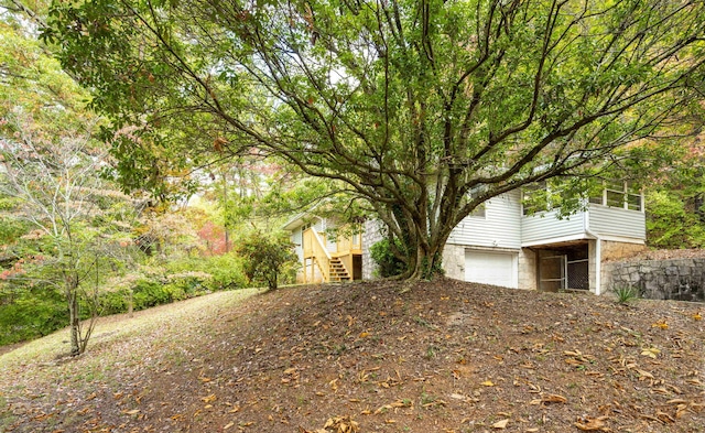 view of yard featuring a garage