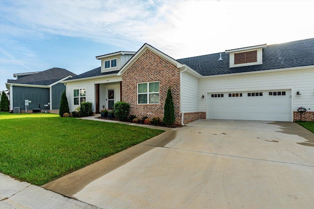 view of front of house featuring a front lawn and a garage