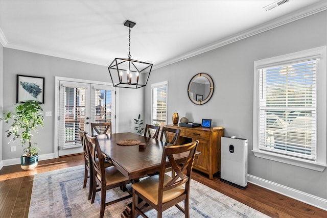 dining room featuring a wealth of natural light and dark hardwood / wood-style floors