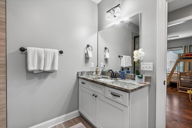 bathroom featuring vanity and hardwood / wood-style floors