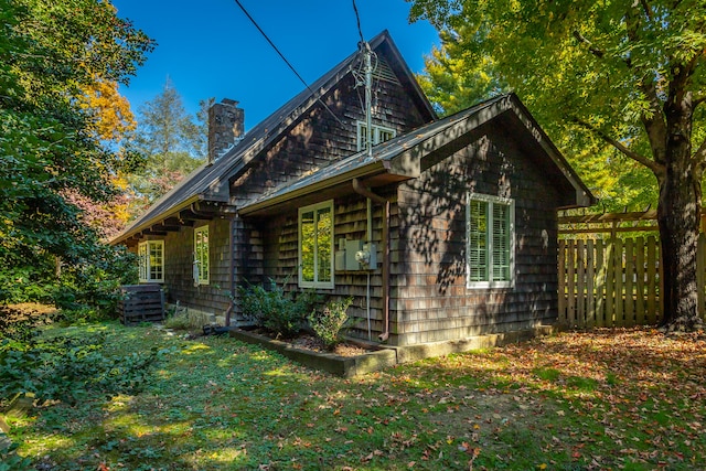 view of property exterior with a yard