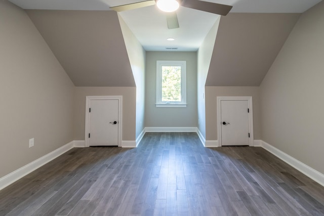 additional living space featuring lofted ceiling, dark hardwood / wood-style floors, and ceiling fan